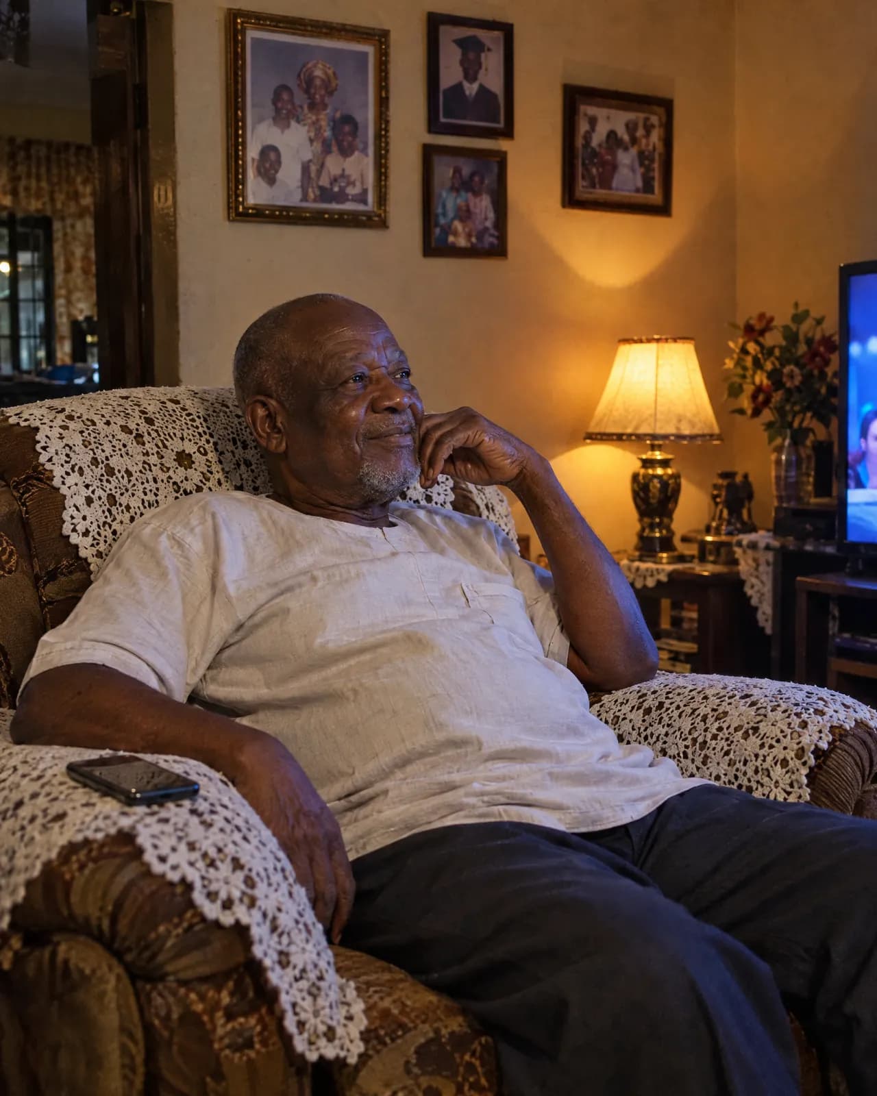 An older man relaxing in his armchair in the evening