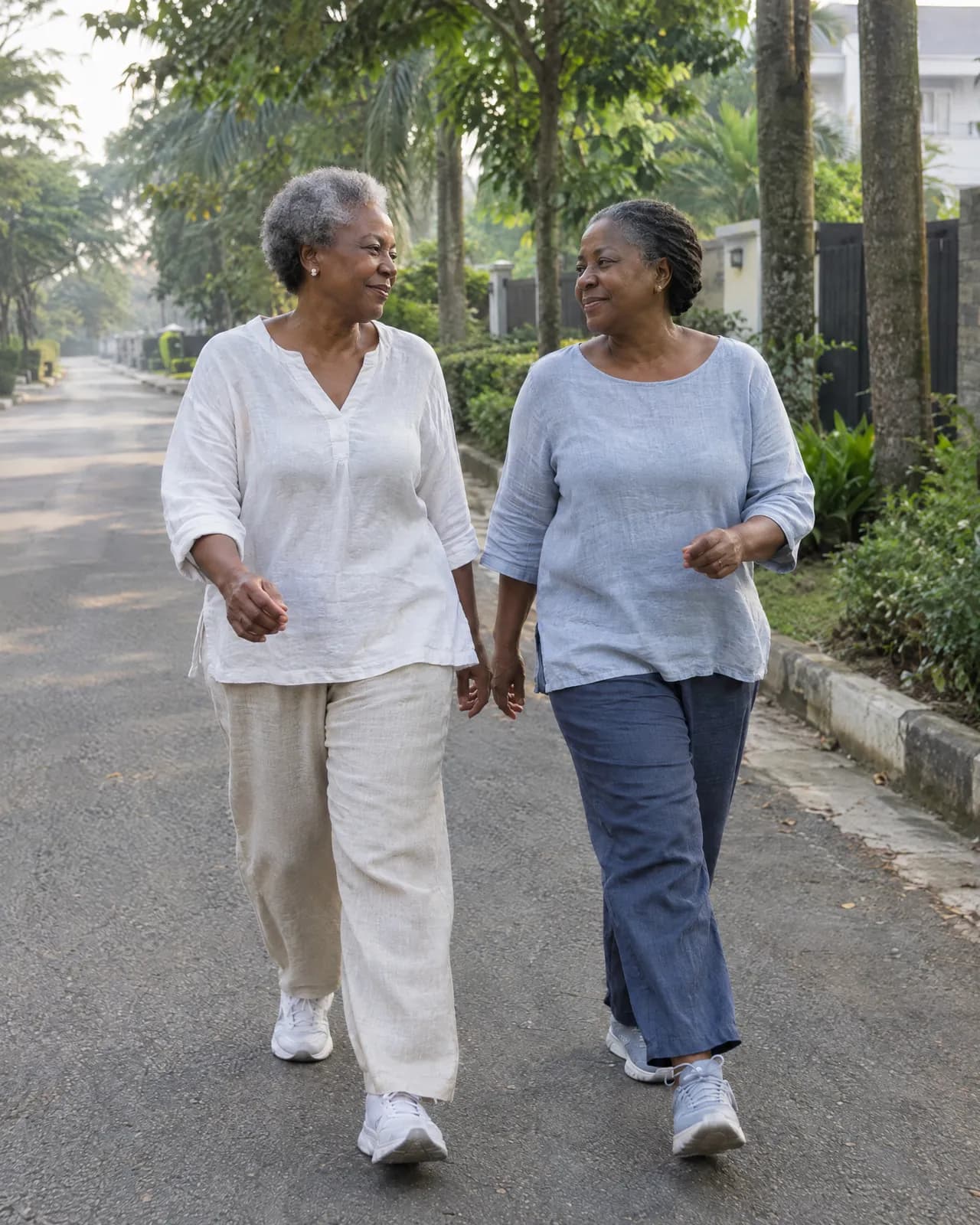 Two older women walking together in the morning, unhurried